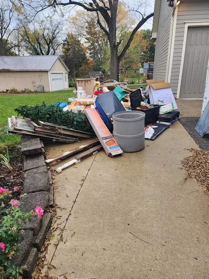 Dumpster being loaded with debris for Commercial Dumpster Rental in California